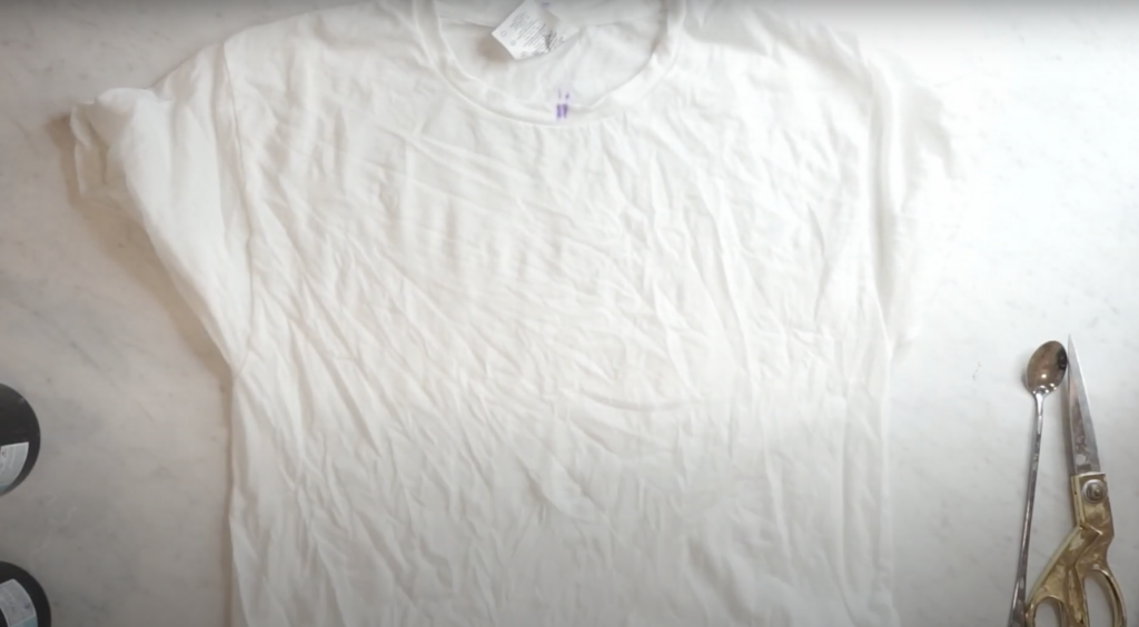 Prepping a shirt to tie dye a heart design with the ice dye method